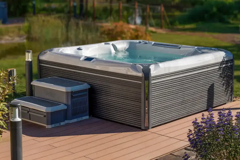 Hot tub with steps on a wooden deck